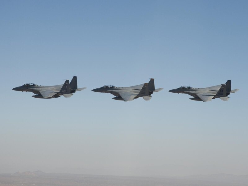 Three fighter jets in formation