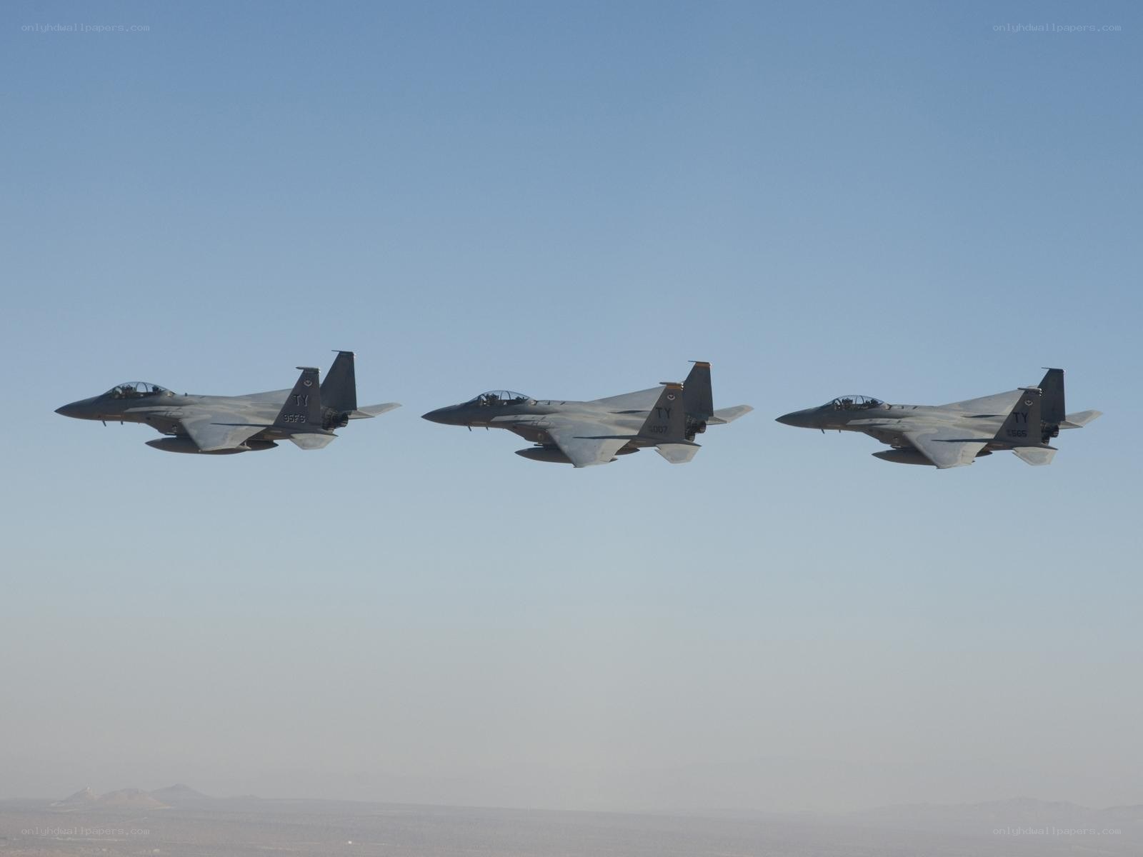Three fighter jets in formation