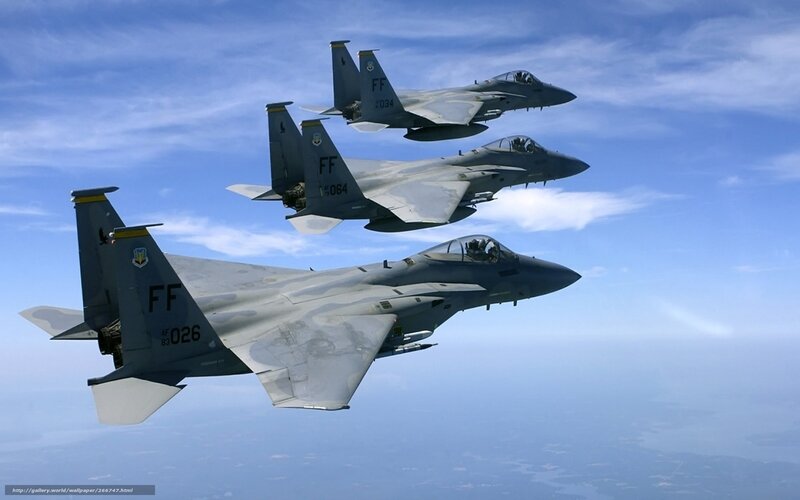 Three fighter jets in formation