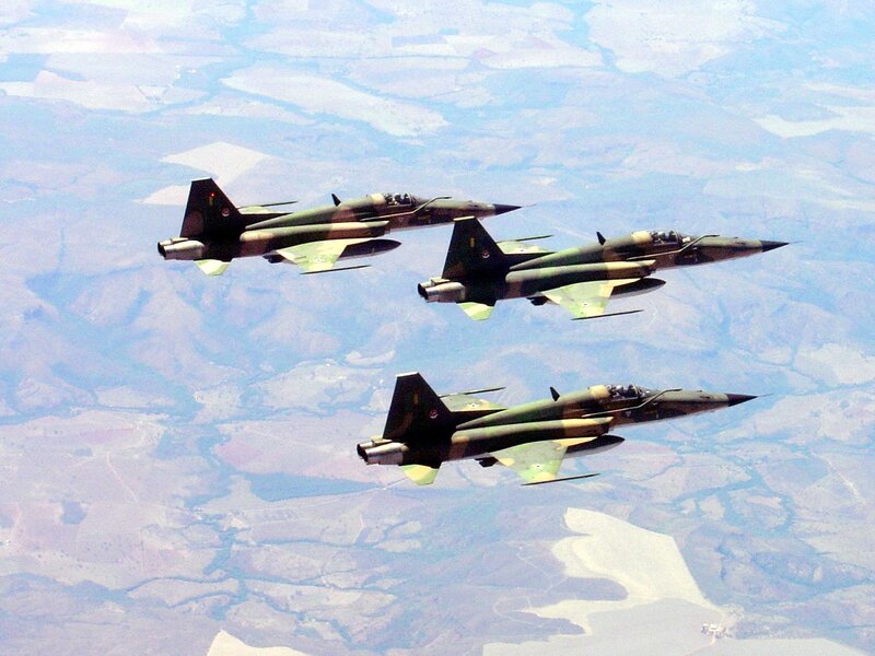 Three fighter jets in formation