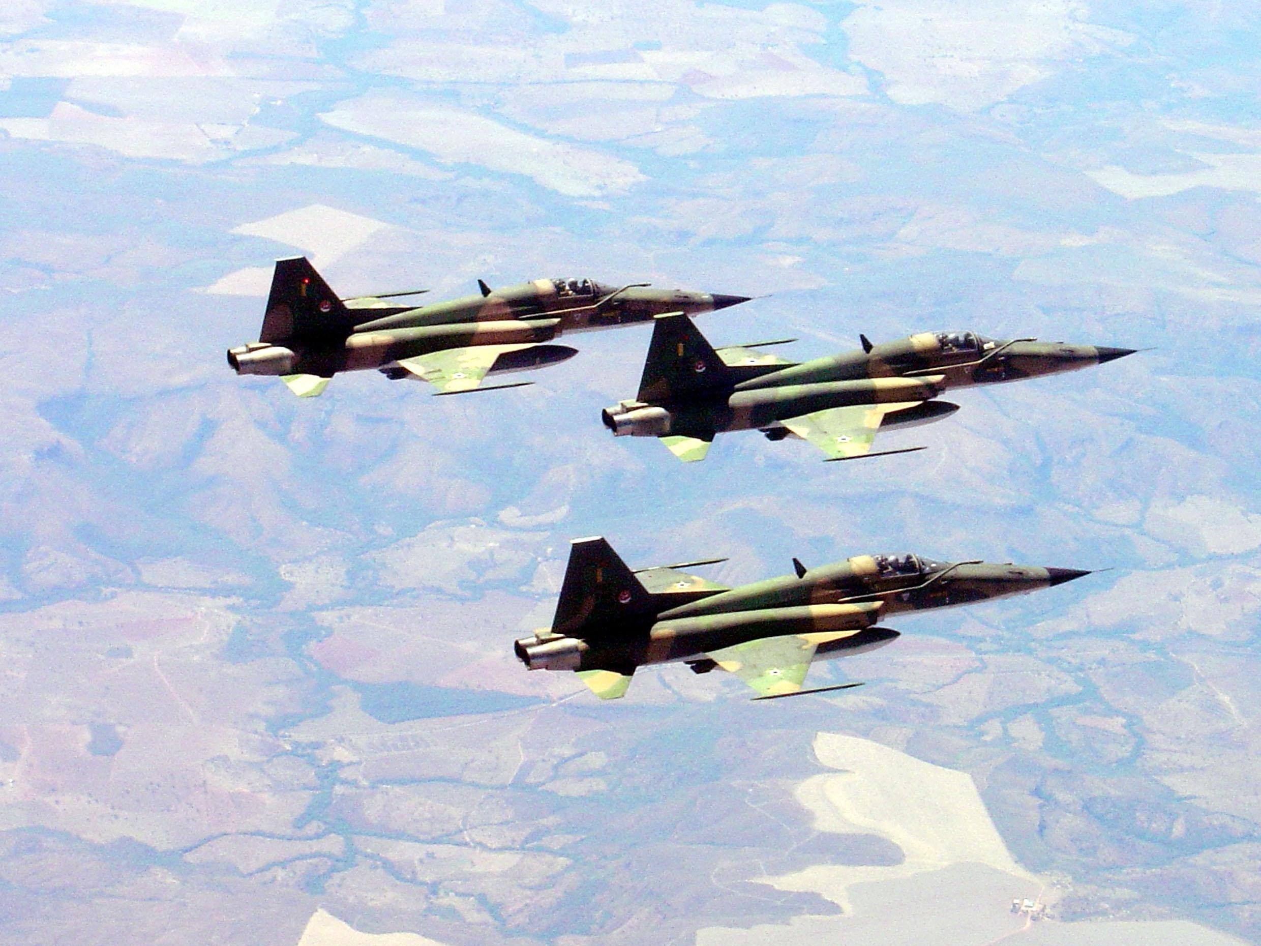 Three fighter jets in formation