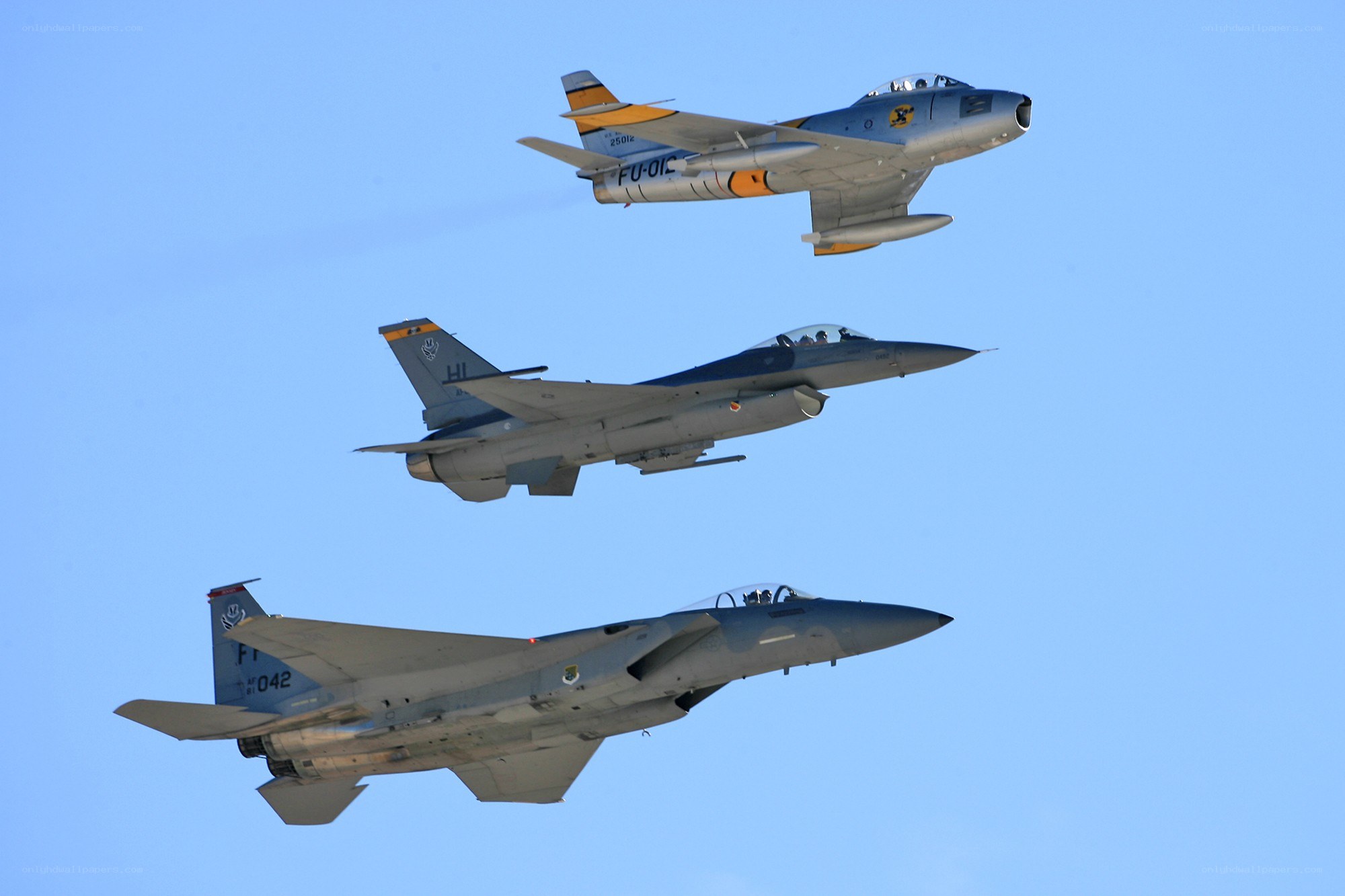 Three fighter jets in formation