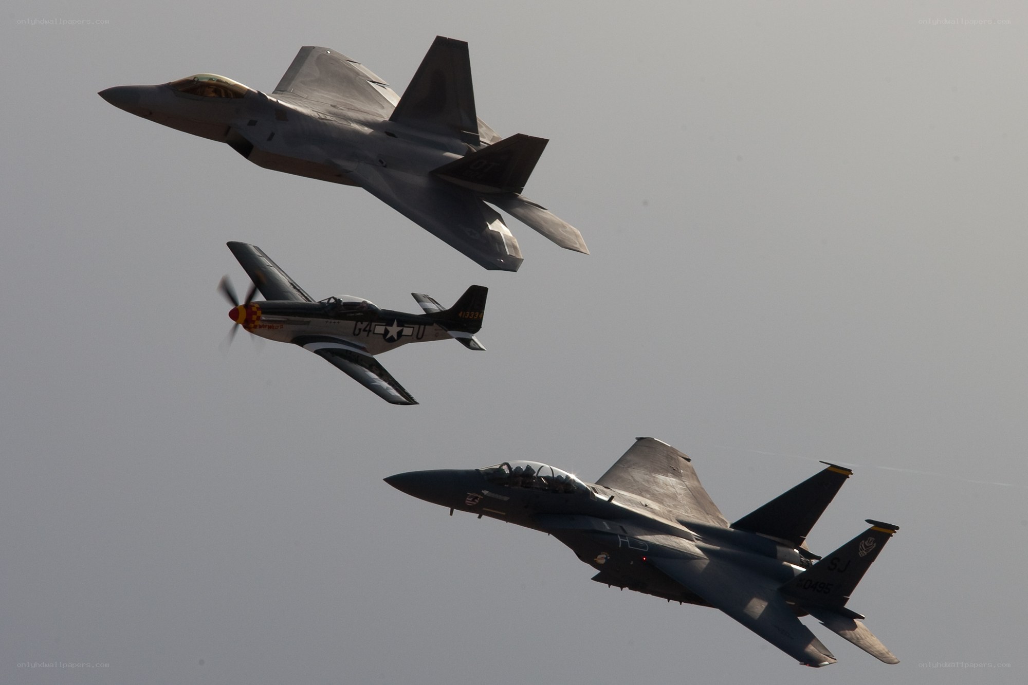 Three fighter jets in formation