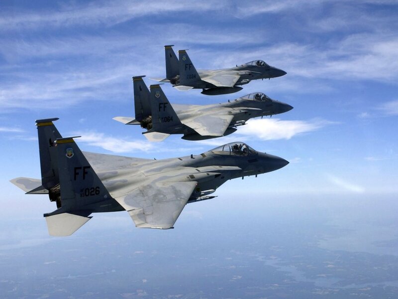 Three fighter jets in formation