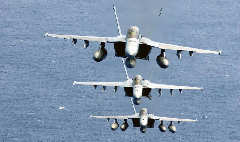 Three fighter jets in formation