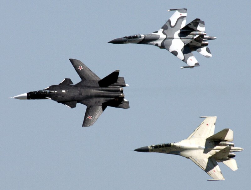 Three fighter jets in formation