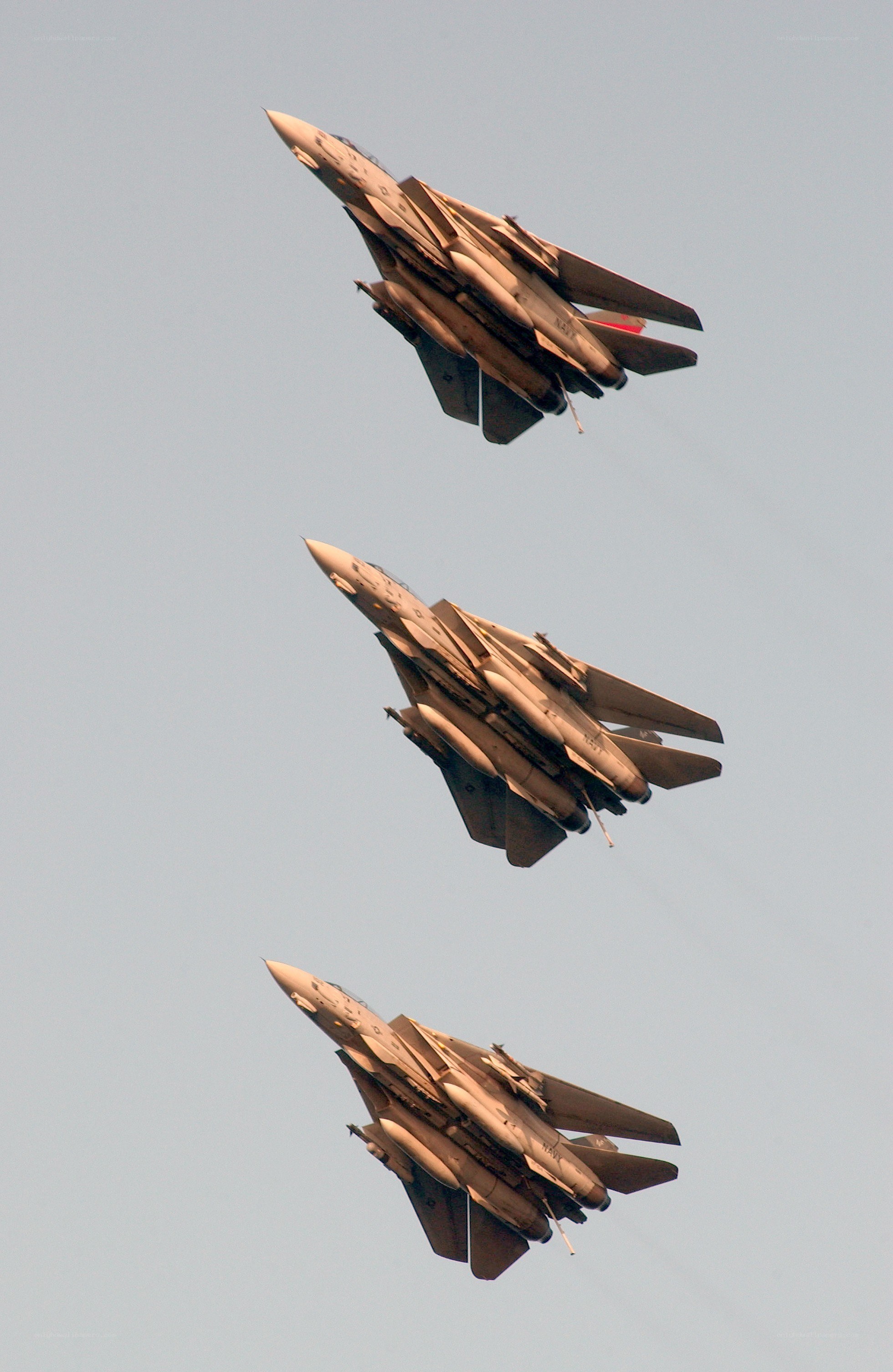 Three fighter jets in formation