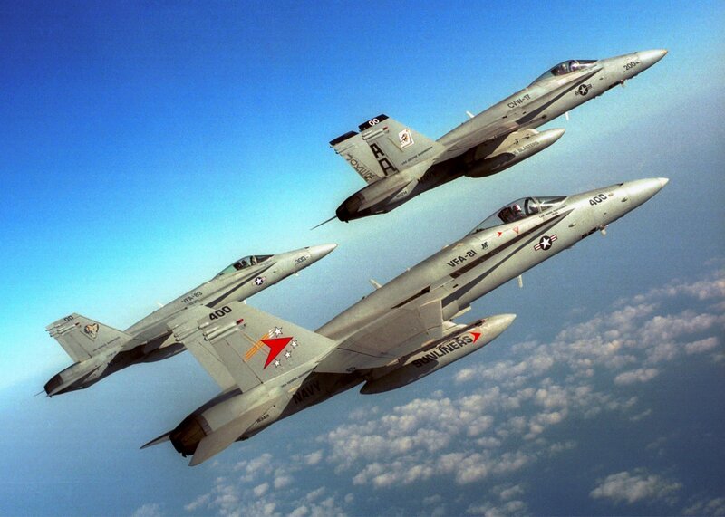 Three fighter jets in formation
