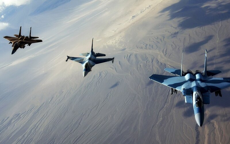 Three Fighter Jets in Formation — Blue