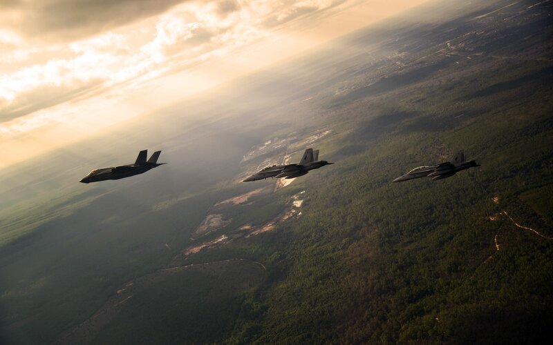 Three Fighter Jets in Formation — Green, Dramatic