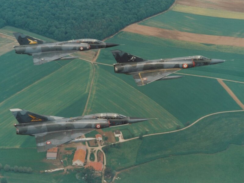 Three Fighter Jets in Formation — Green