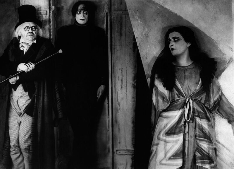 Three figures in a dramatic scene