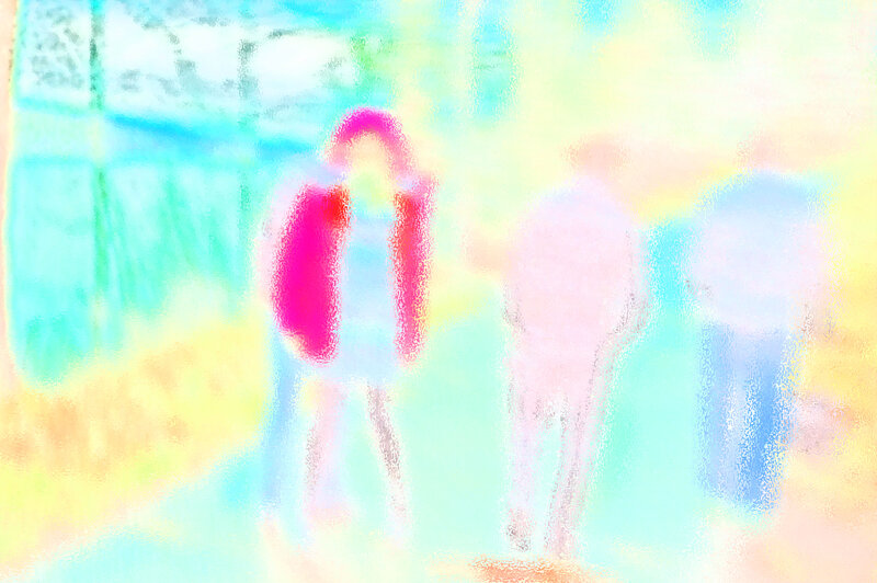 Three Figures in Colorful Blur