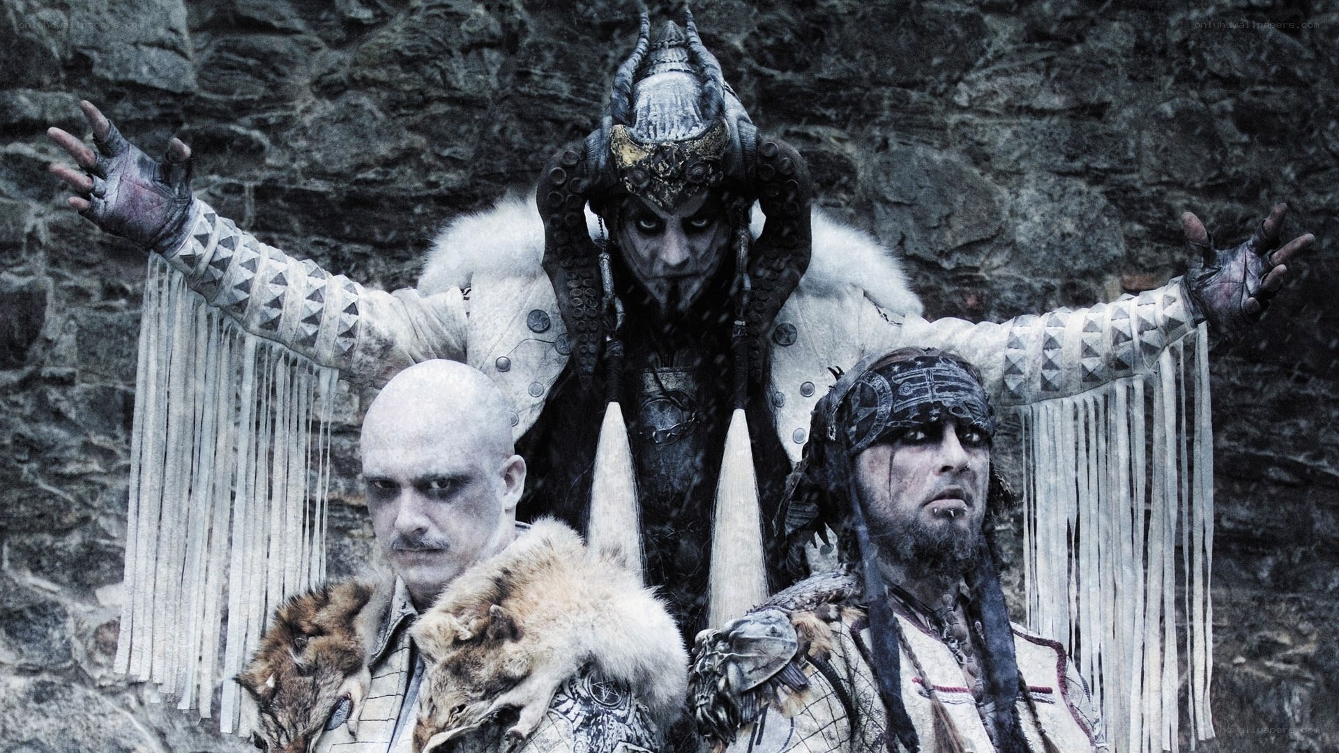 three figures in dark fantasy attire