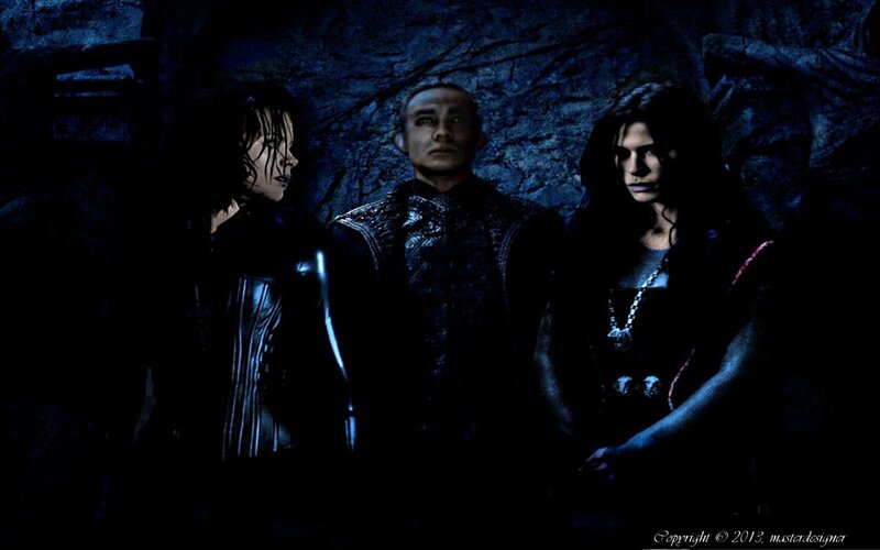 Three Figures in Dark Setting — Blue