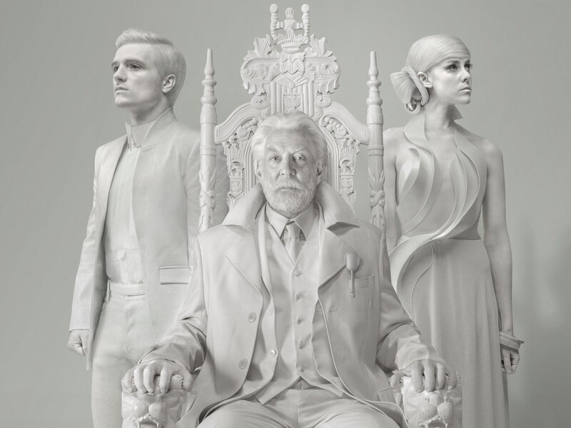 Three figures in white attire