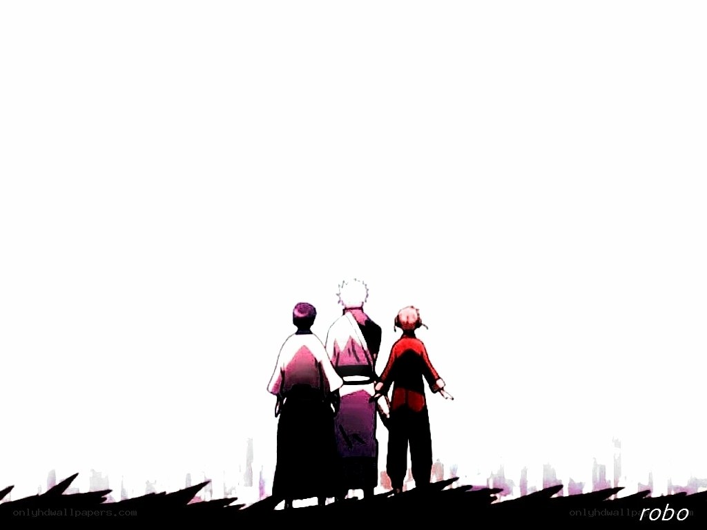 three figures on a hill