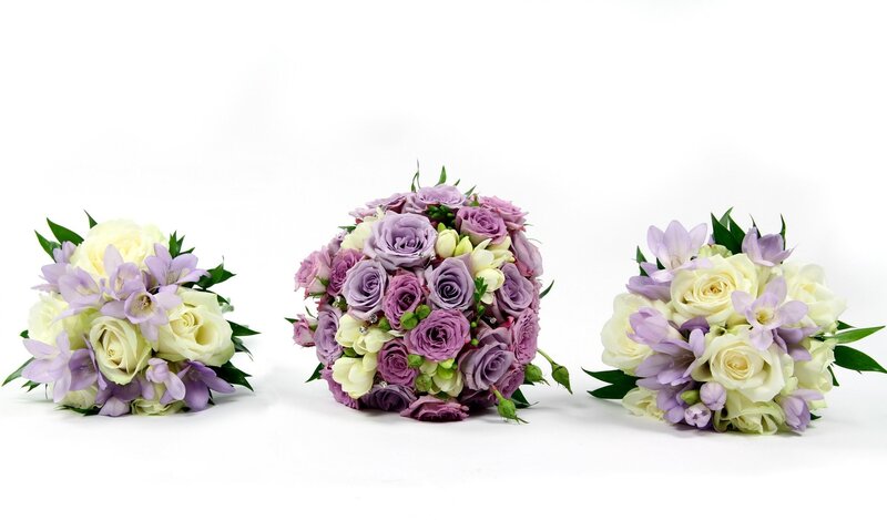 Three floral bouquets in purple and white