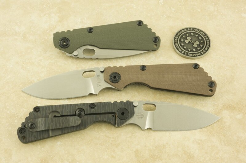 Three folding knives on display
