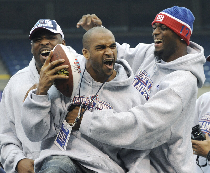 Three Football Players Celebrating