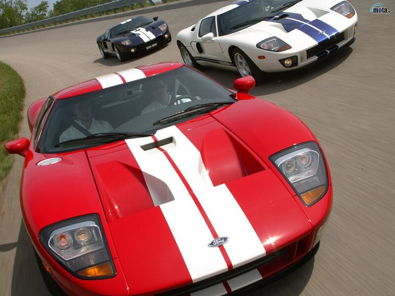 Three Ford GT cars on a racetrack