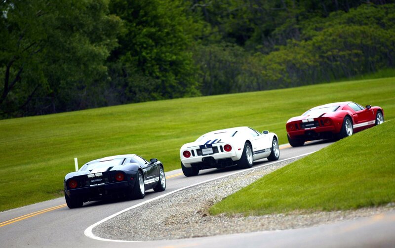 Three Ford GT cars on a road