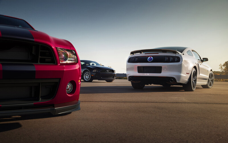 Three Ford Mustang Cars — Red, Dramatic