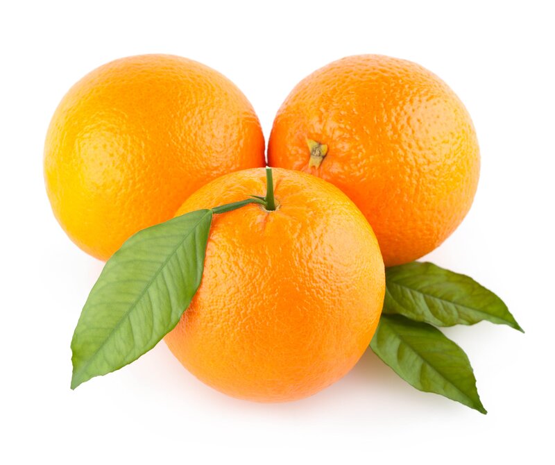 Three fresh oranges with leaves