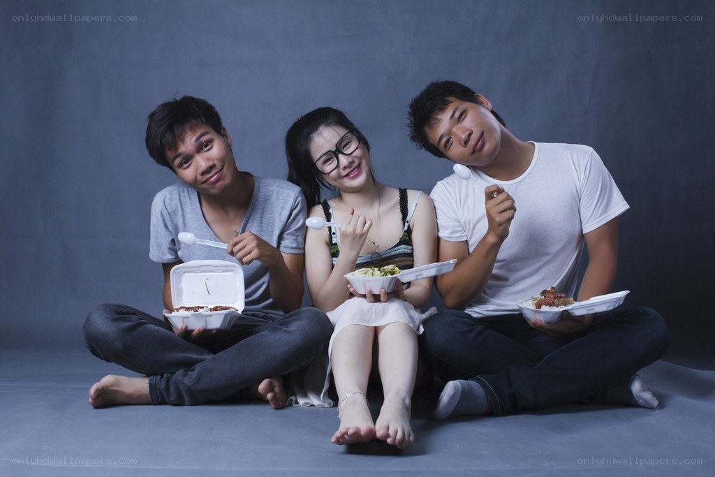 Three friends eating takeout