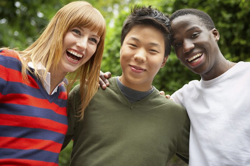 three friends laughing together
