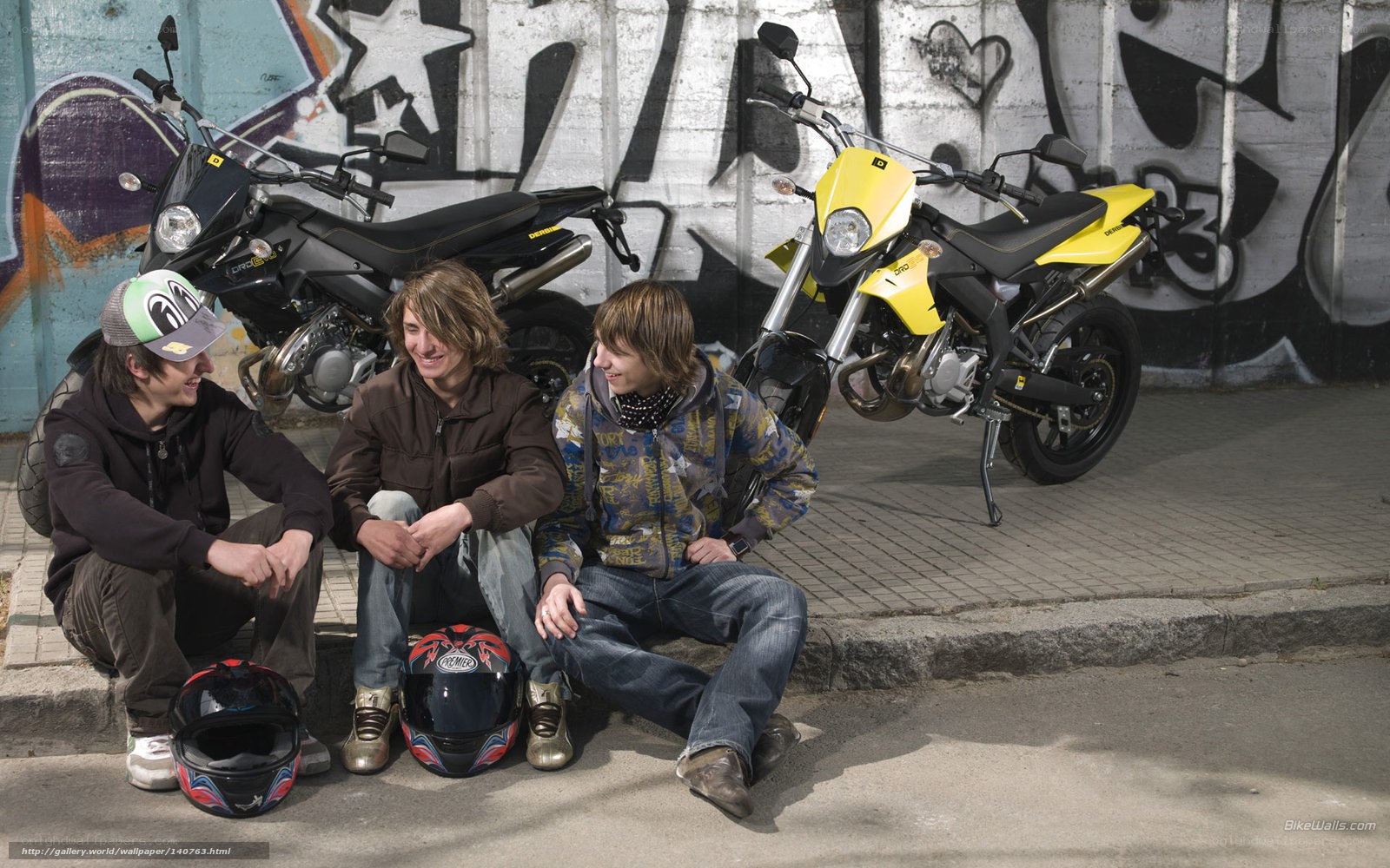 Three friends with motorcycles
