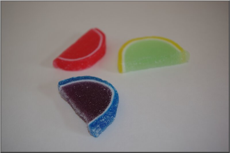 three fruit-shaped gummy candies