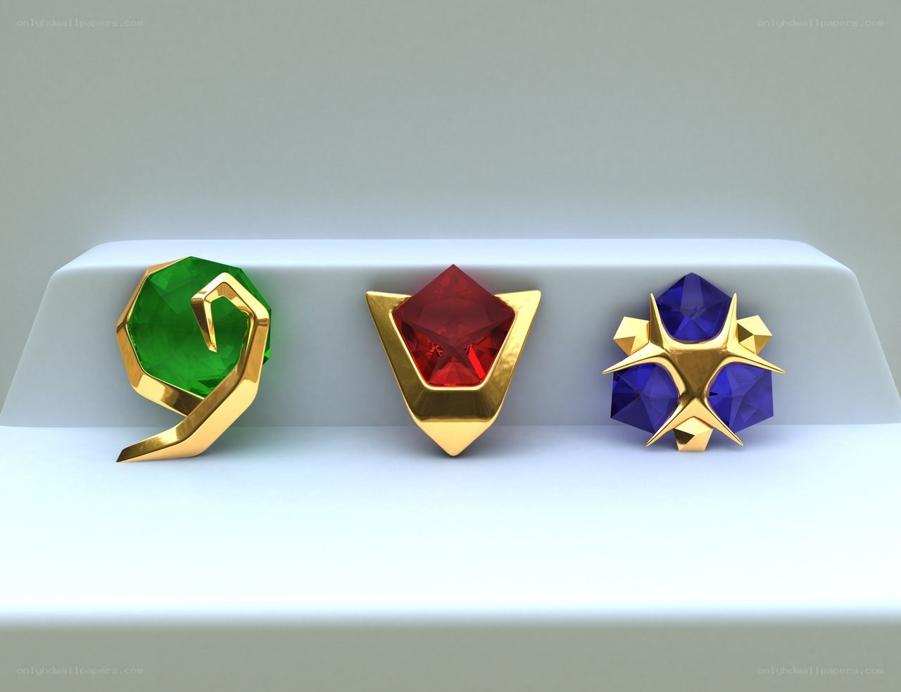 three gemstone artifacts