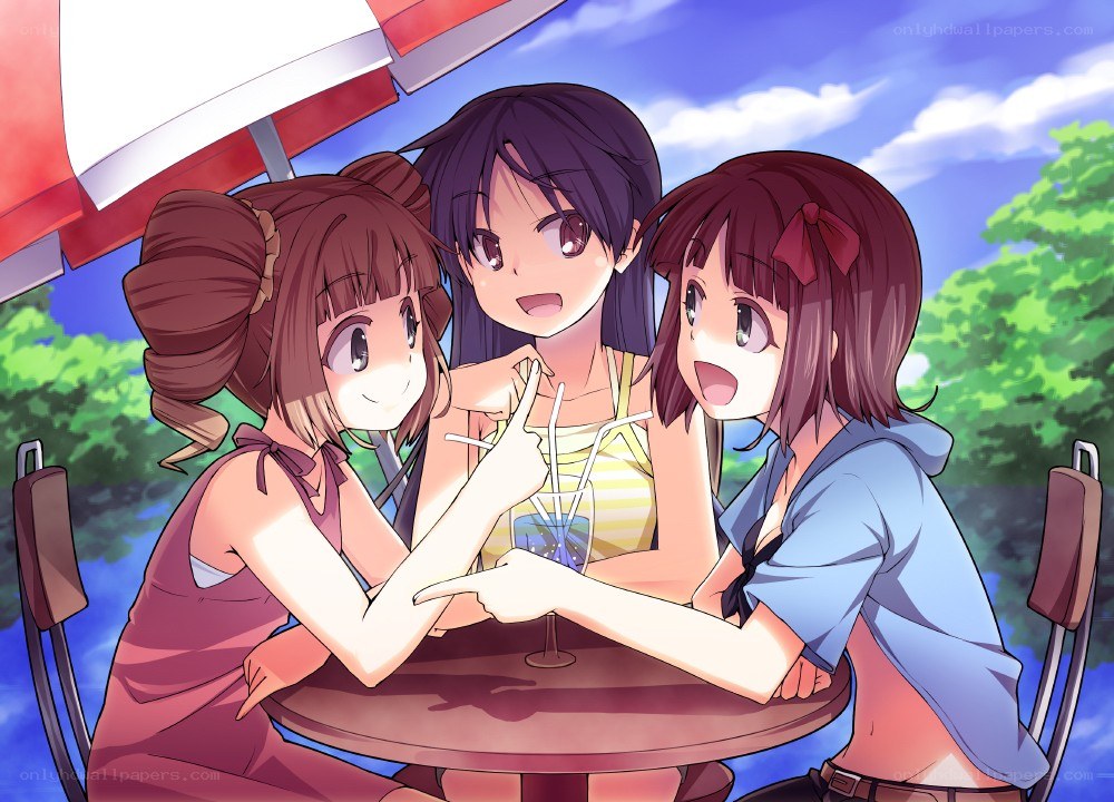 Three girls at a cafe table