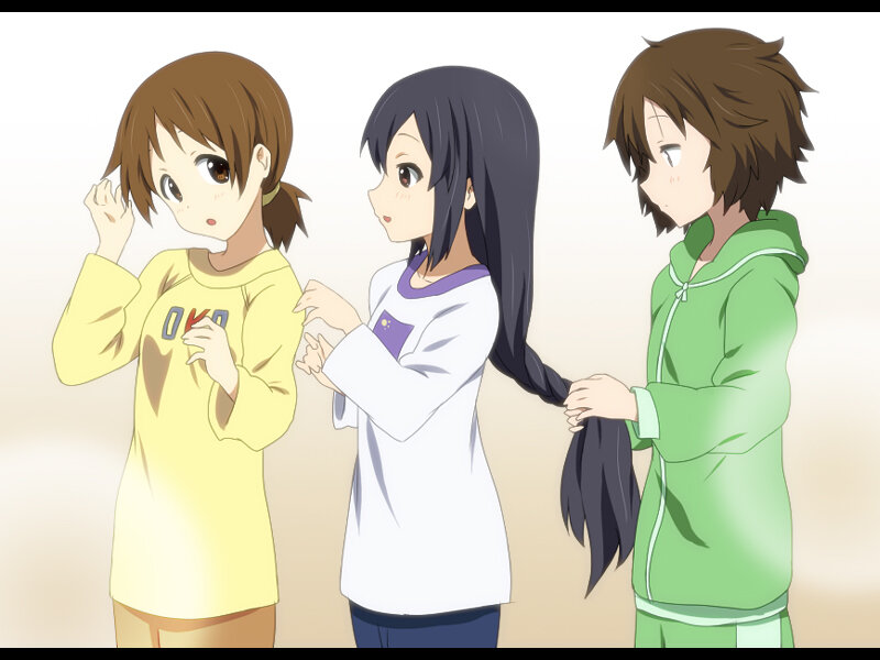 three girls braiding hair