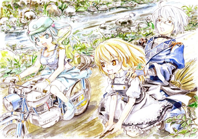 Three girls by a stream