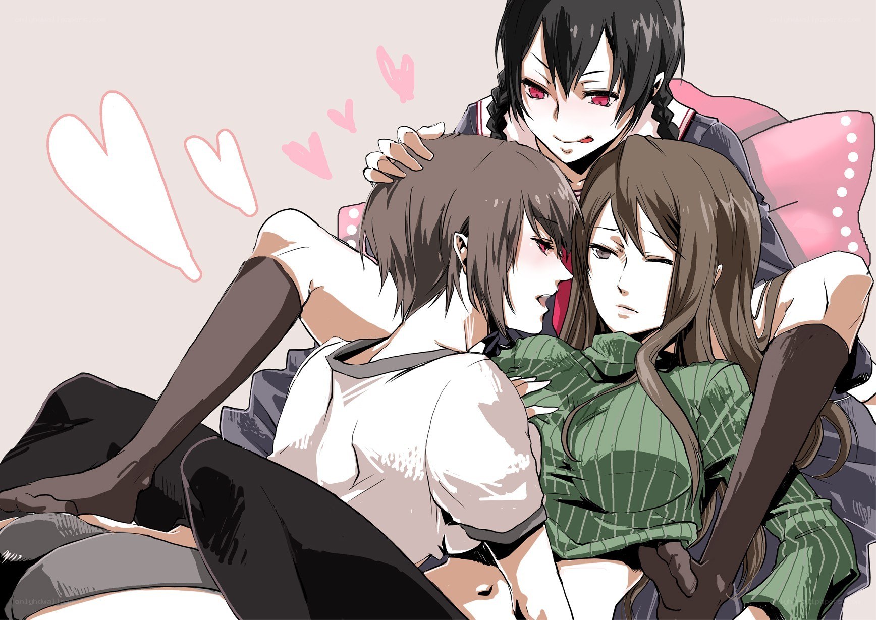 Three girls cuddling on a couch