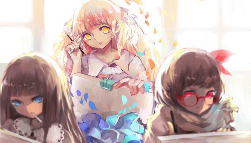 Three girls drawing in a classroom
