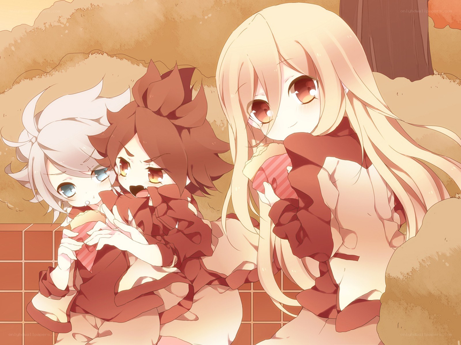three girls eating snacks