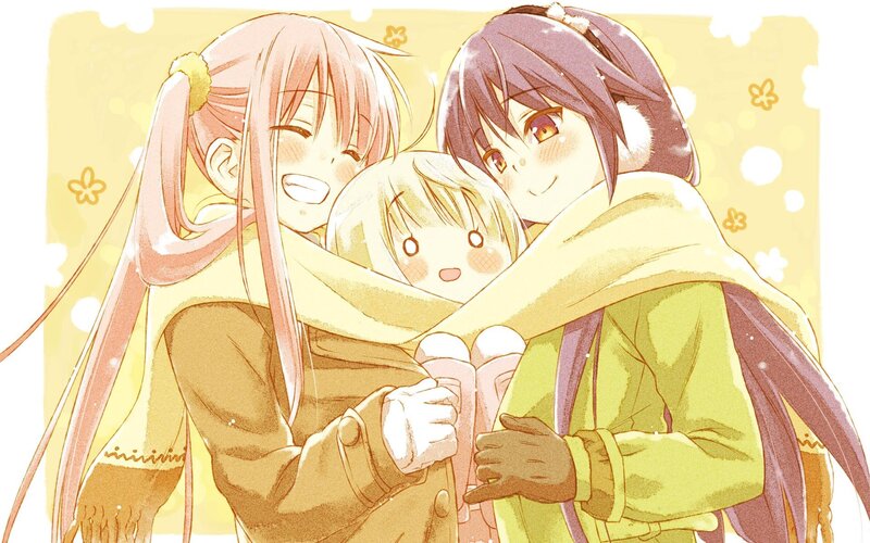 three girls hugging in winter