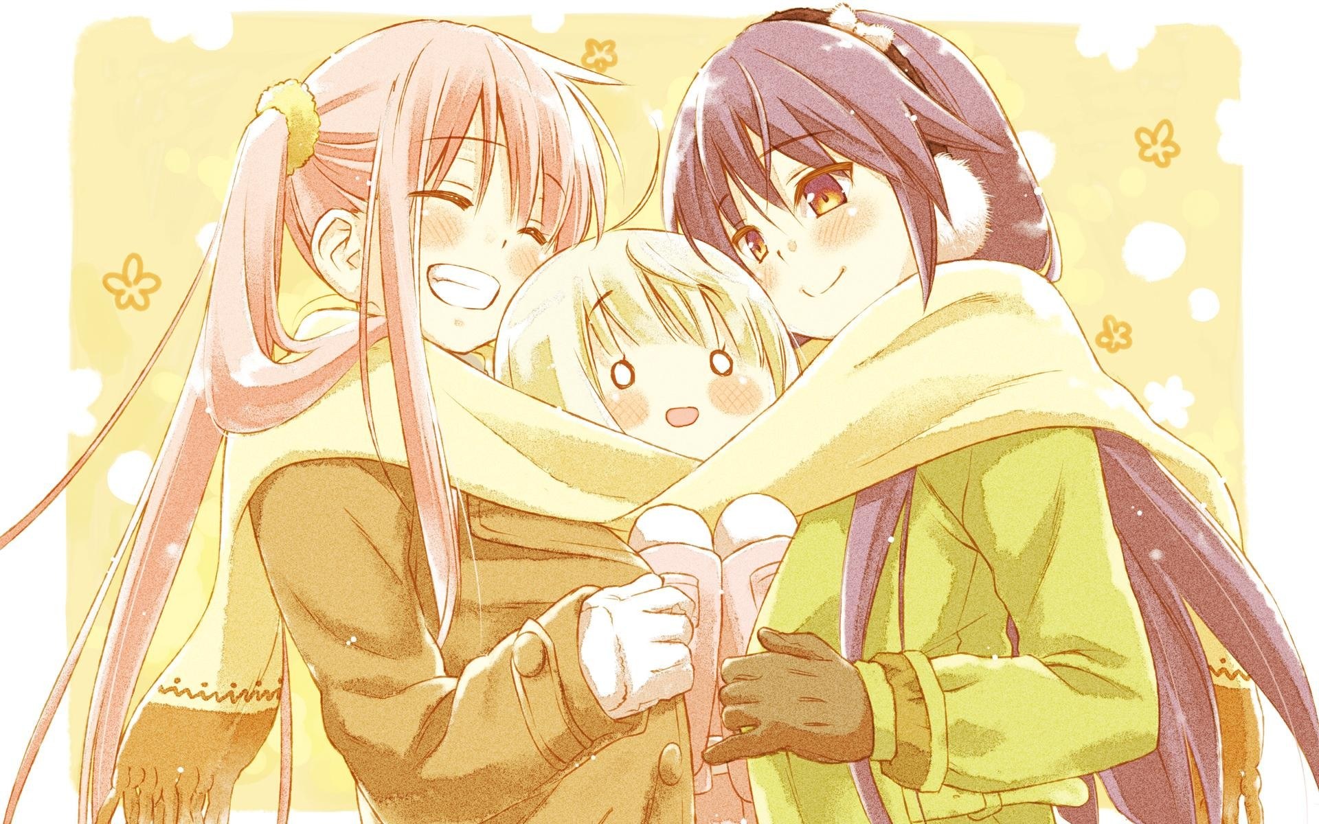 three girls hugging in winter