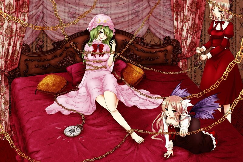 Three girls in a bed with chains