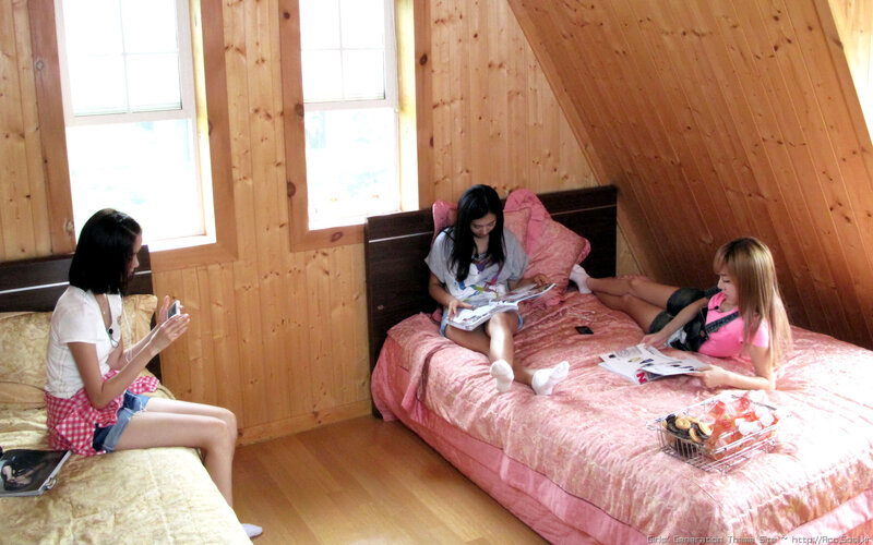 Three girls in a wooden room