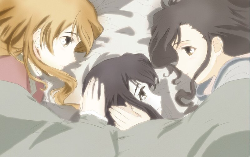 three girls in bed together