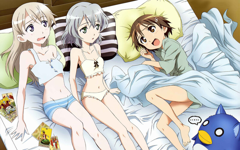 Three girls in bed with tarot cards