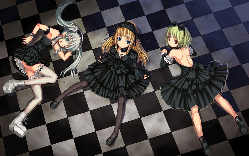 Three girls in black dresses on a checkered floor