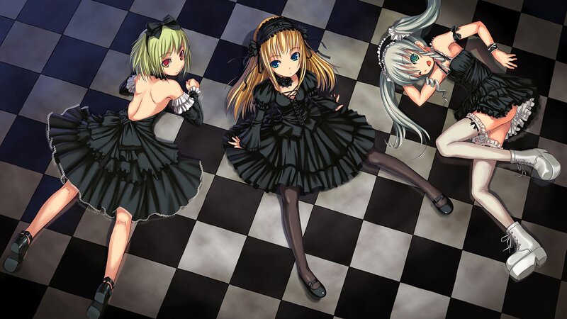 Three girls in black dresses on checkered floor