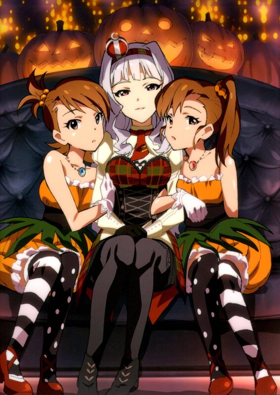 Three girls in Halloween costumes