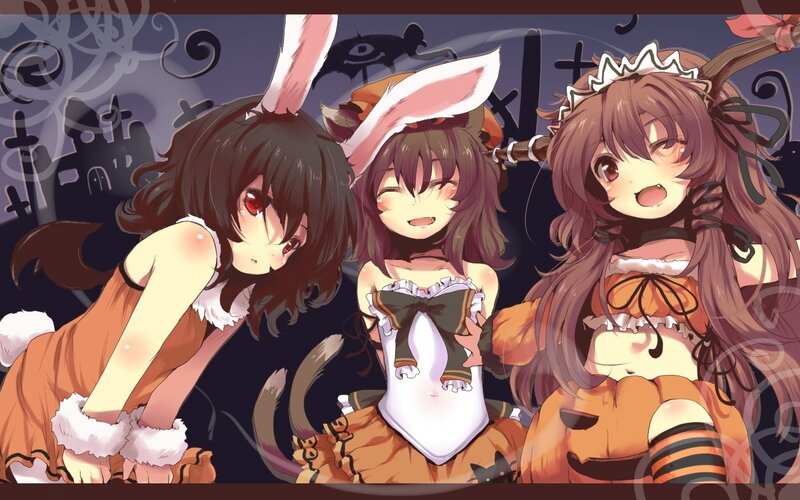 Three girls in Halloween costumes