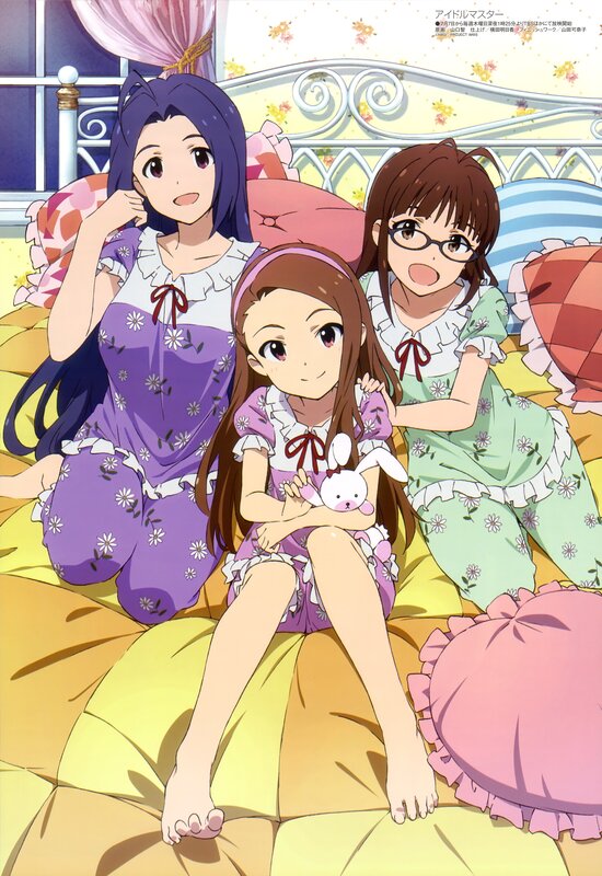Three girls in pajamas on a bed